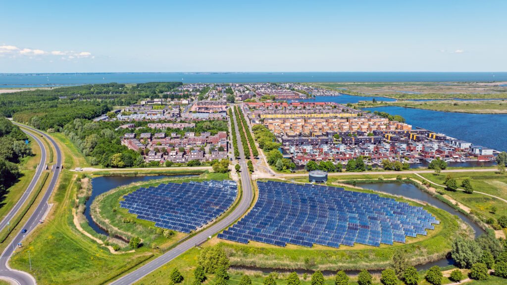 Lightning Strikes Twice: Europe's Energy Gambit and the Productivity Paradox aerial from solar panels in a circle, called sun island in almere netherlands